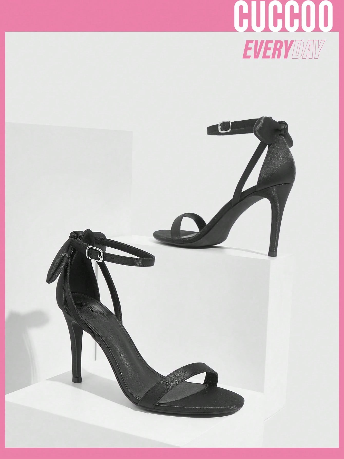 Black high heel sandals with bow detail for spring and summer.