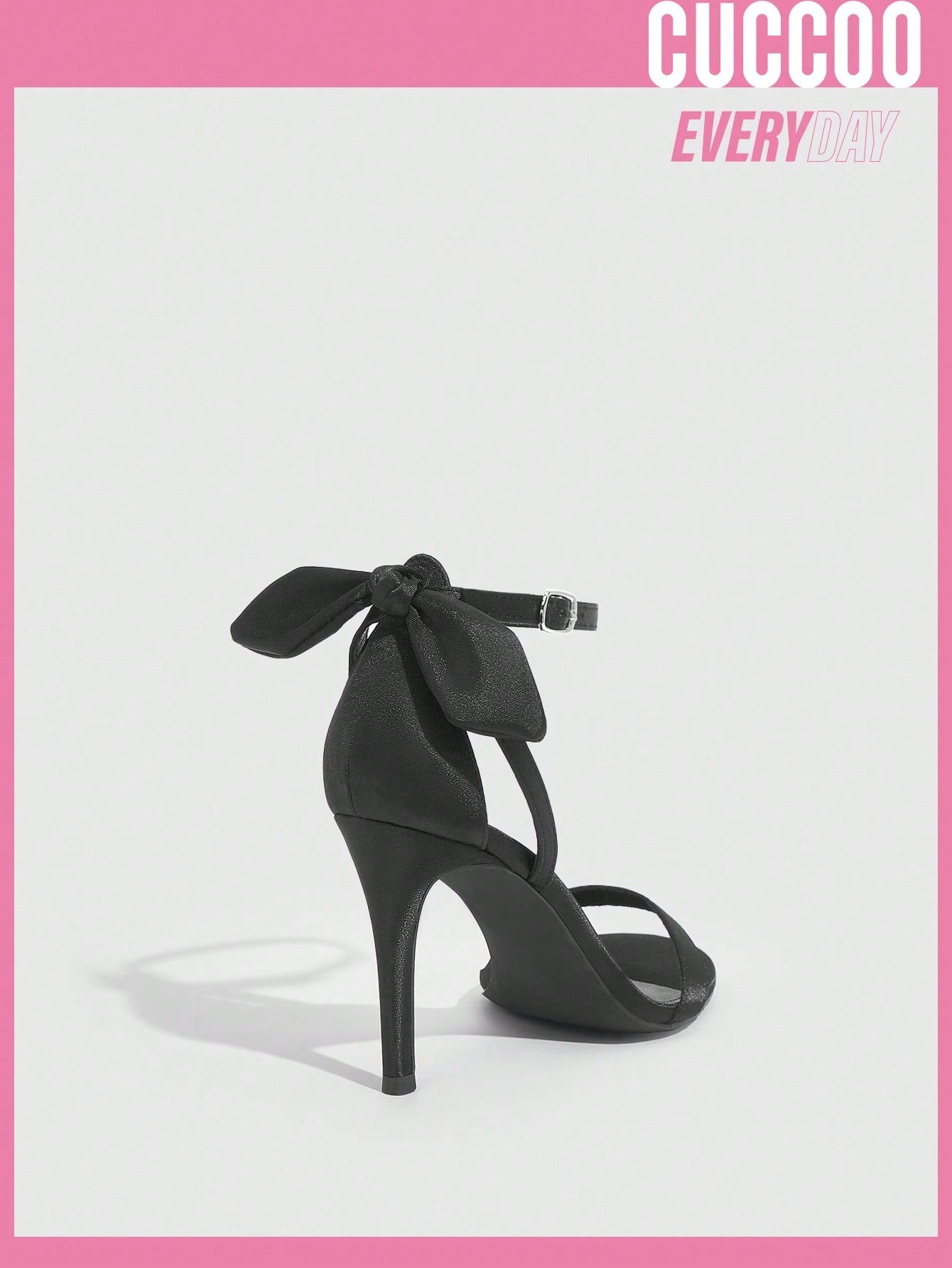 Black high heel sandals with bow detail for spring and summer.