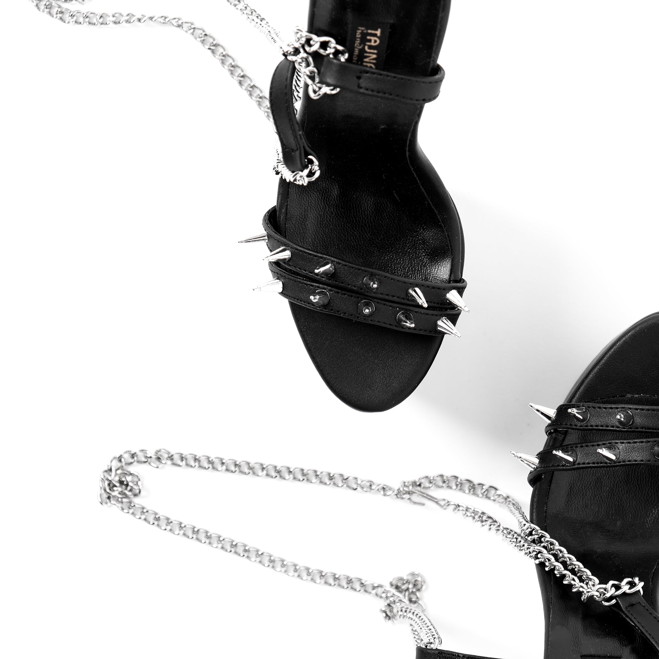 Black high heel sandals with long chain laces.