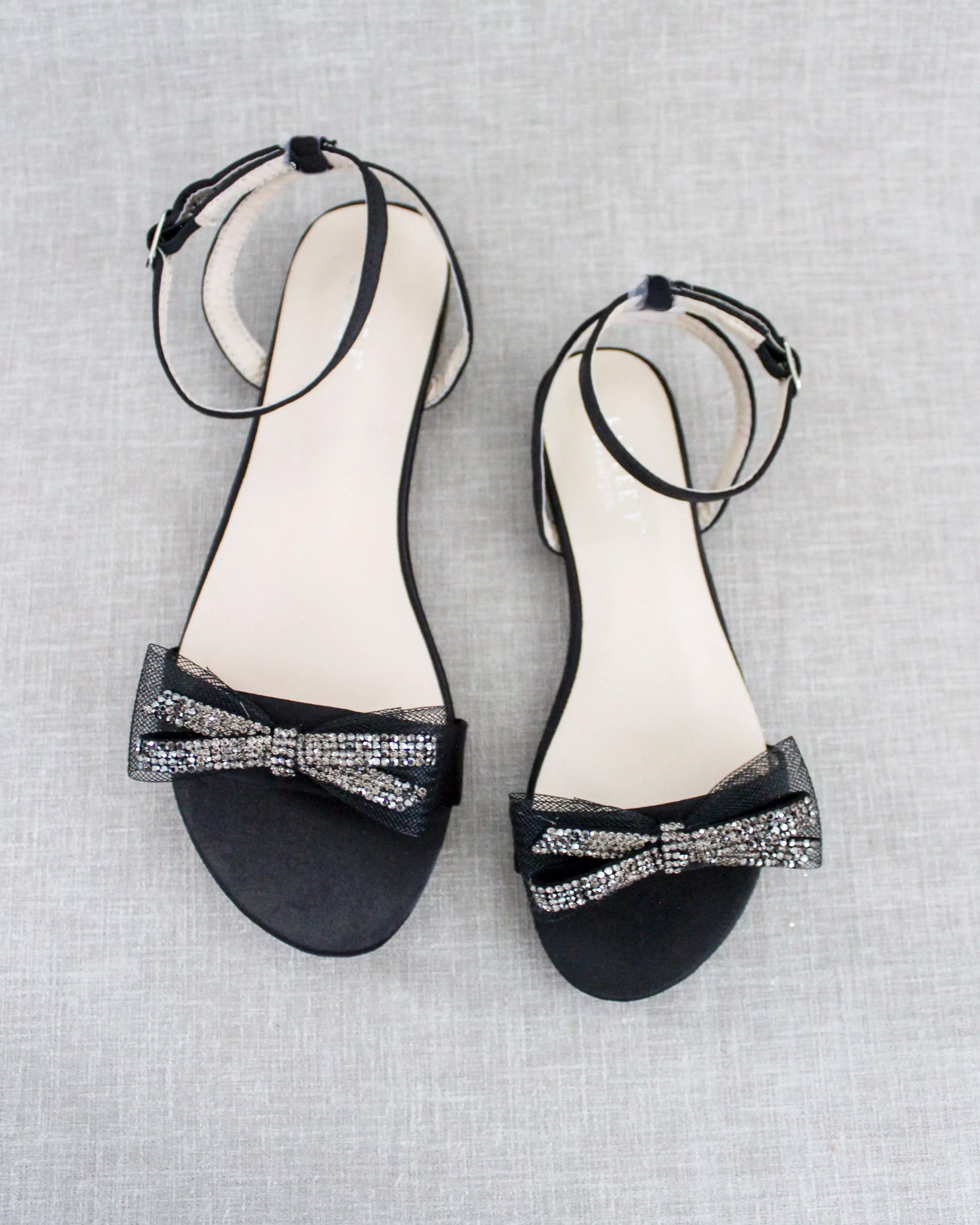 Black Satin Flat Sandal with Sparkling Rhinestone Bow and Ankle Strap