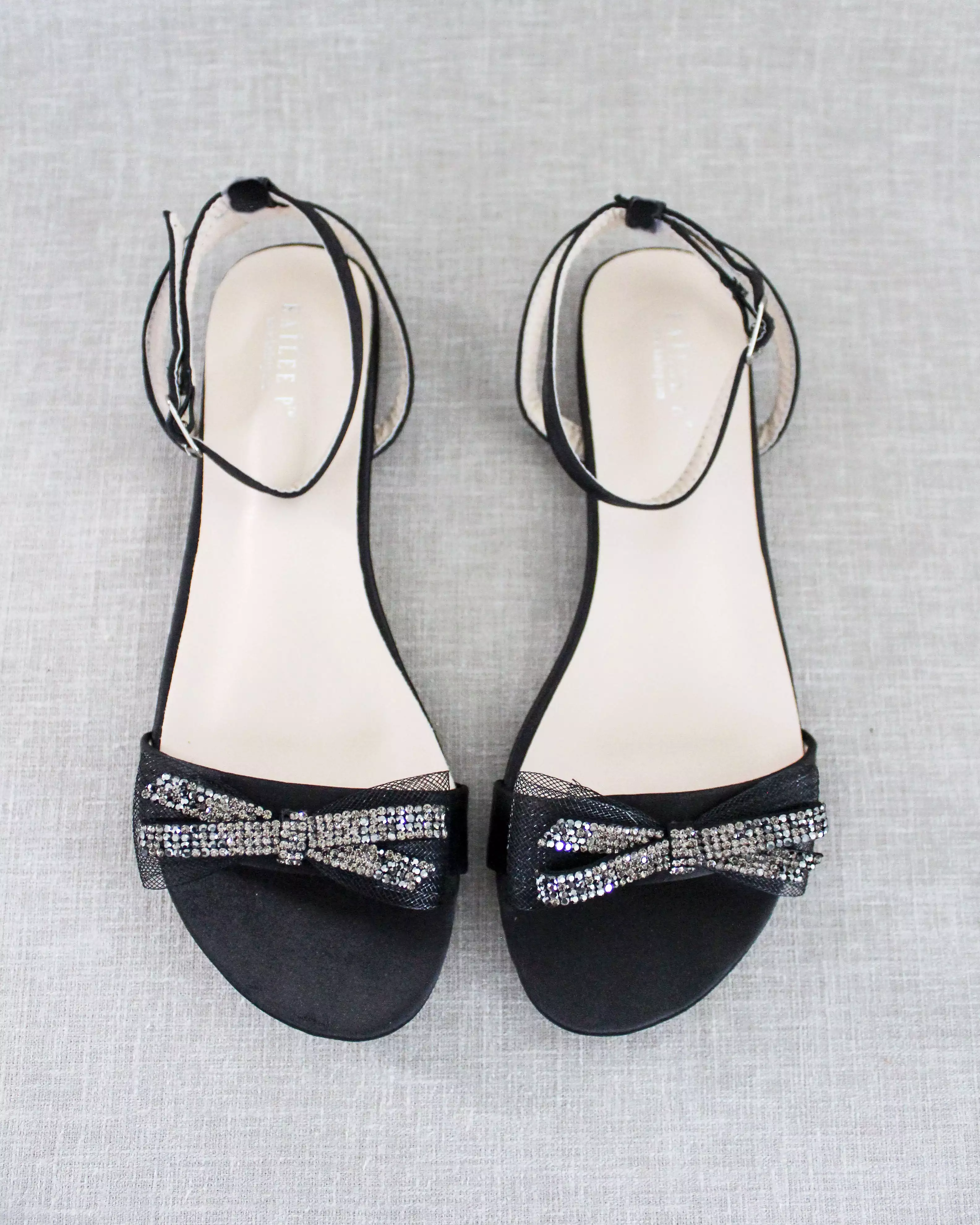 Black Satin Flat Sandal with Sparkling Rhinestone Bow and Ankle Strap