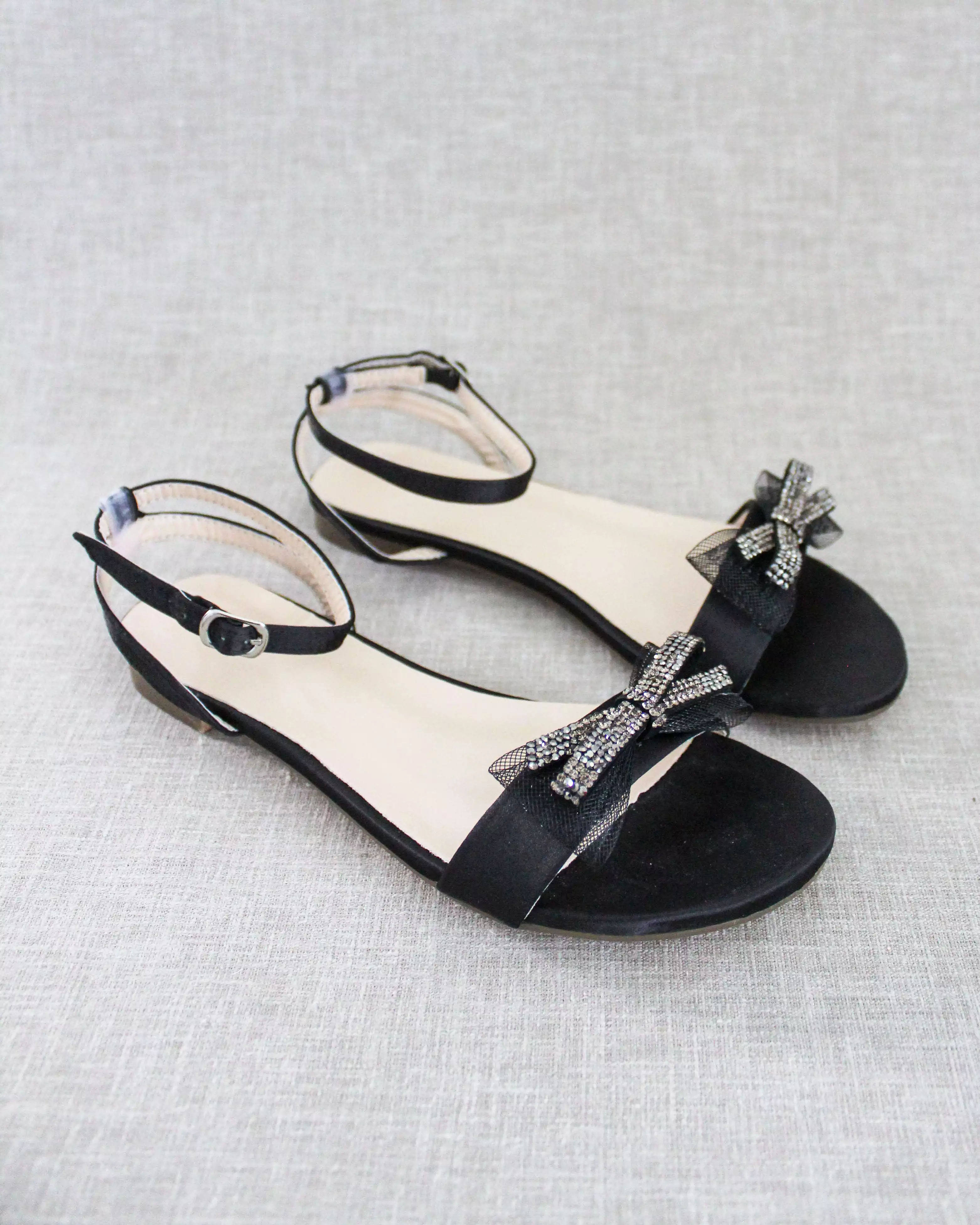 Black Satin Flat Sandal with Sparkling Rhinestone Bow and Ankle Strap