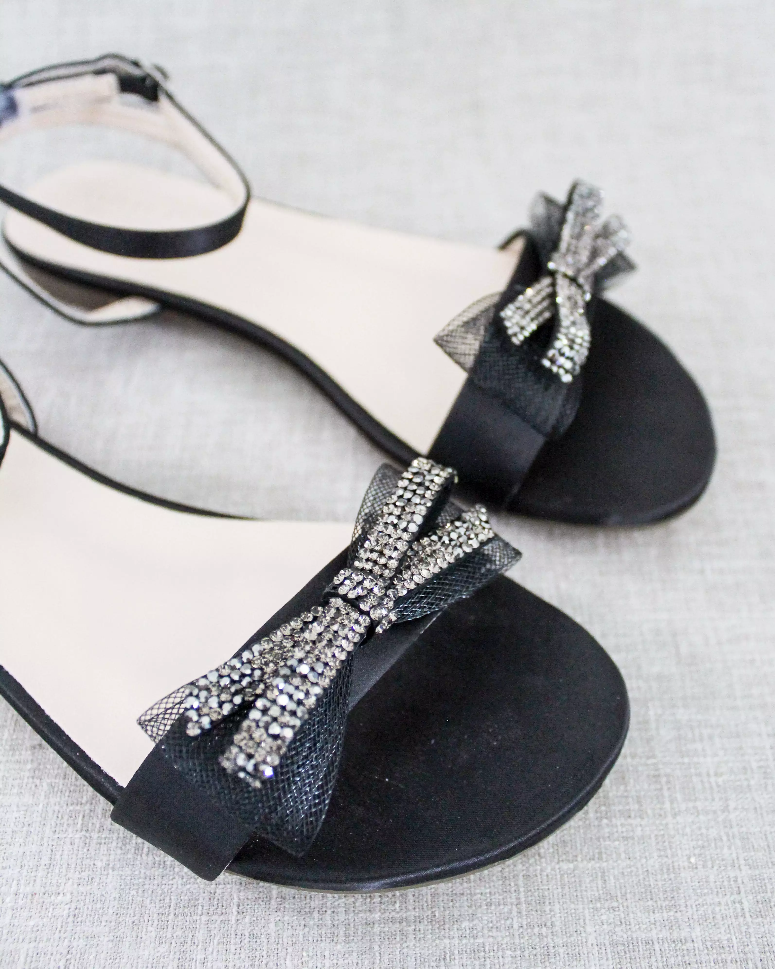 Black Satin Flat Sandal with Sparkling Rhinestone Bow and Ankle Strap