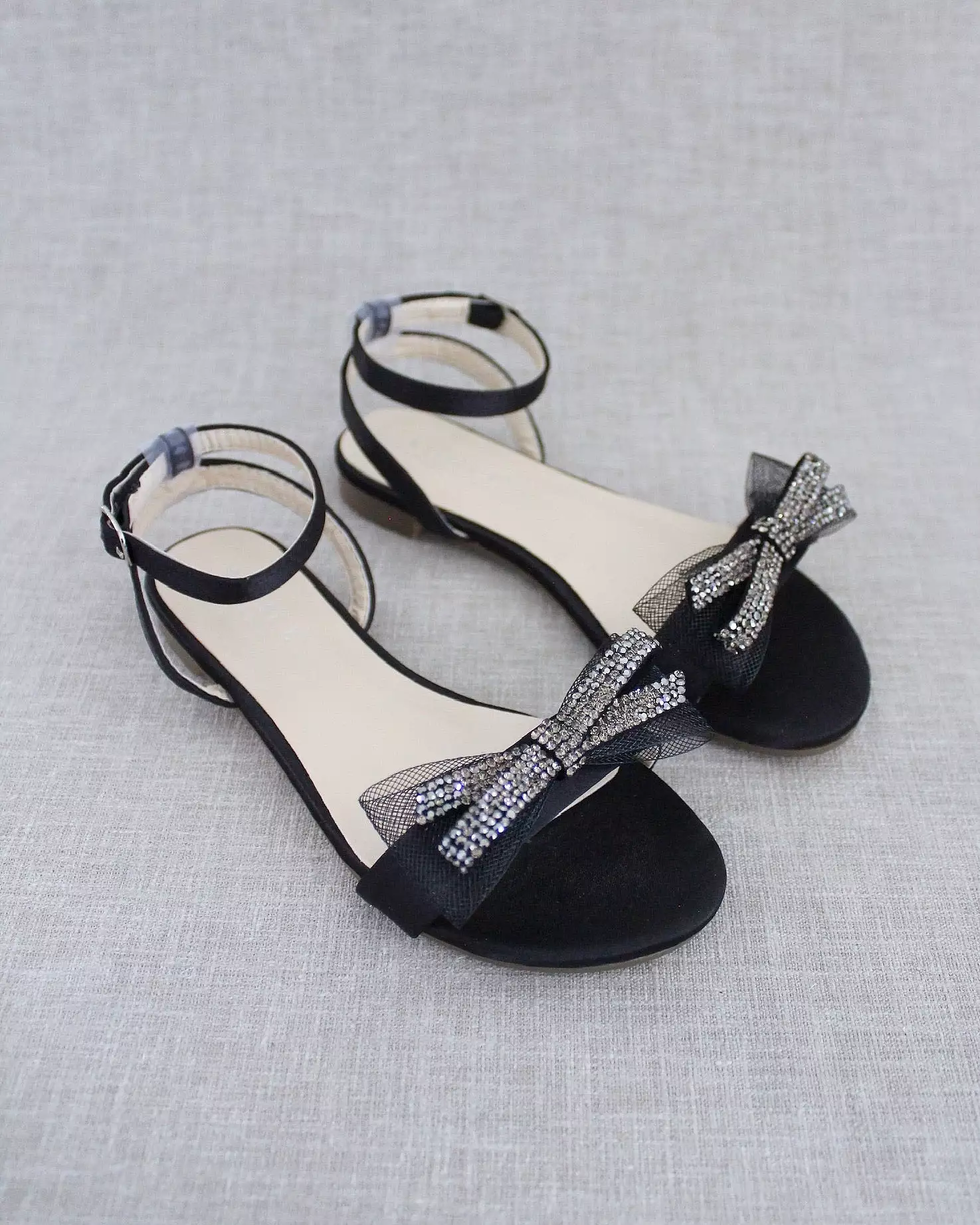 Black Satin Flat Sandal with Sparkling Rhinestone Bow and Ankle Strap