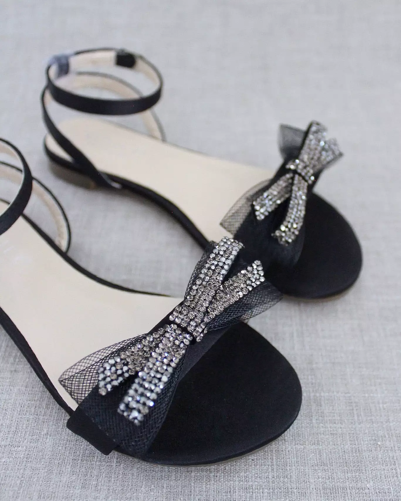 Black Satin Flat Sandal with Sparkling Rhinestone Bow and Ankle Strap