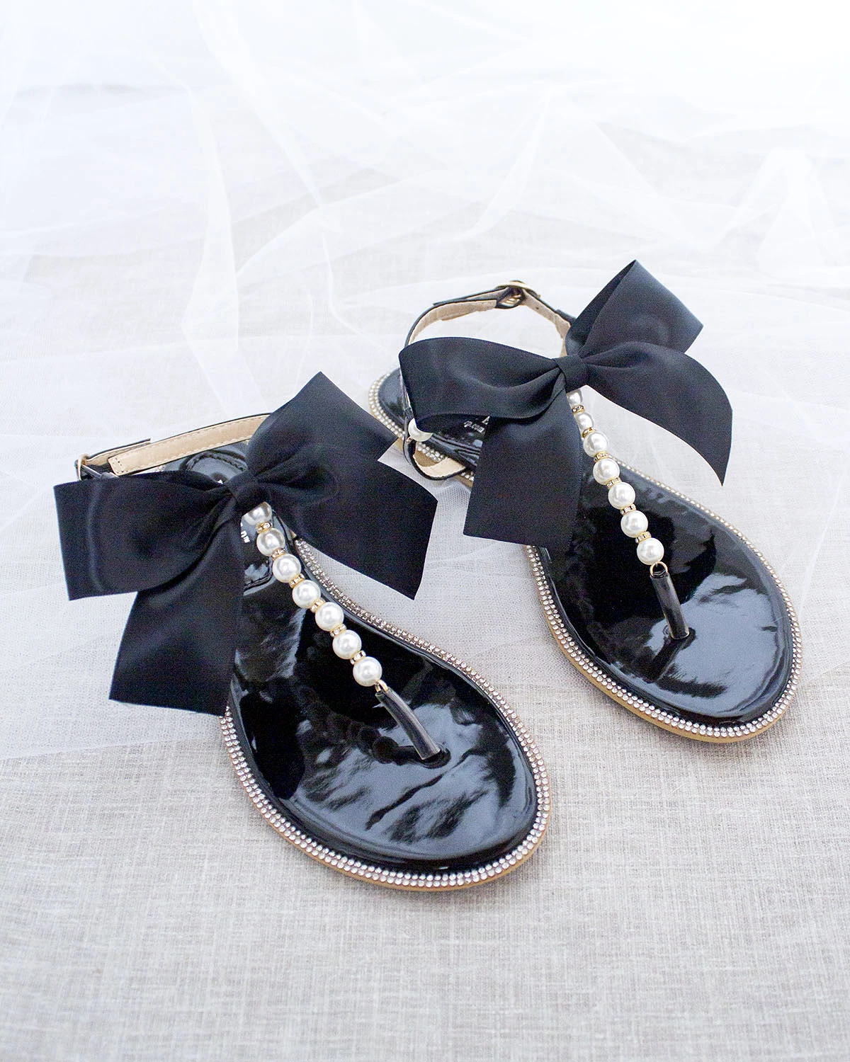 Black T-Strap Pearl Sandals with Rhinestone Embellishments and Large Satin Bow