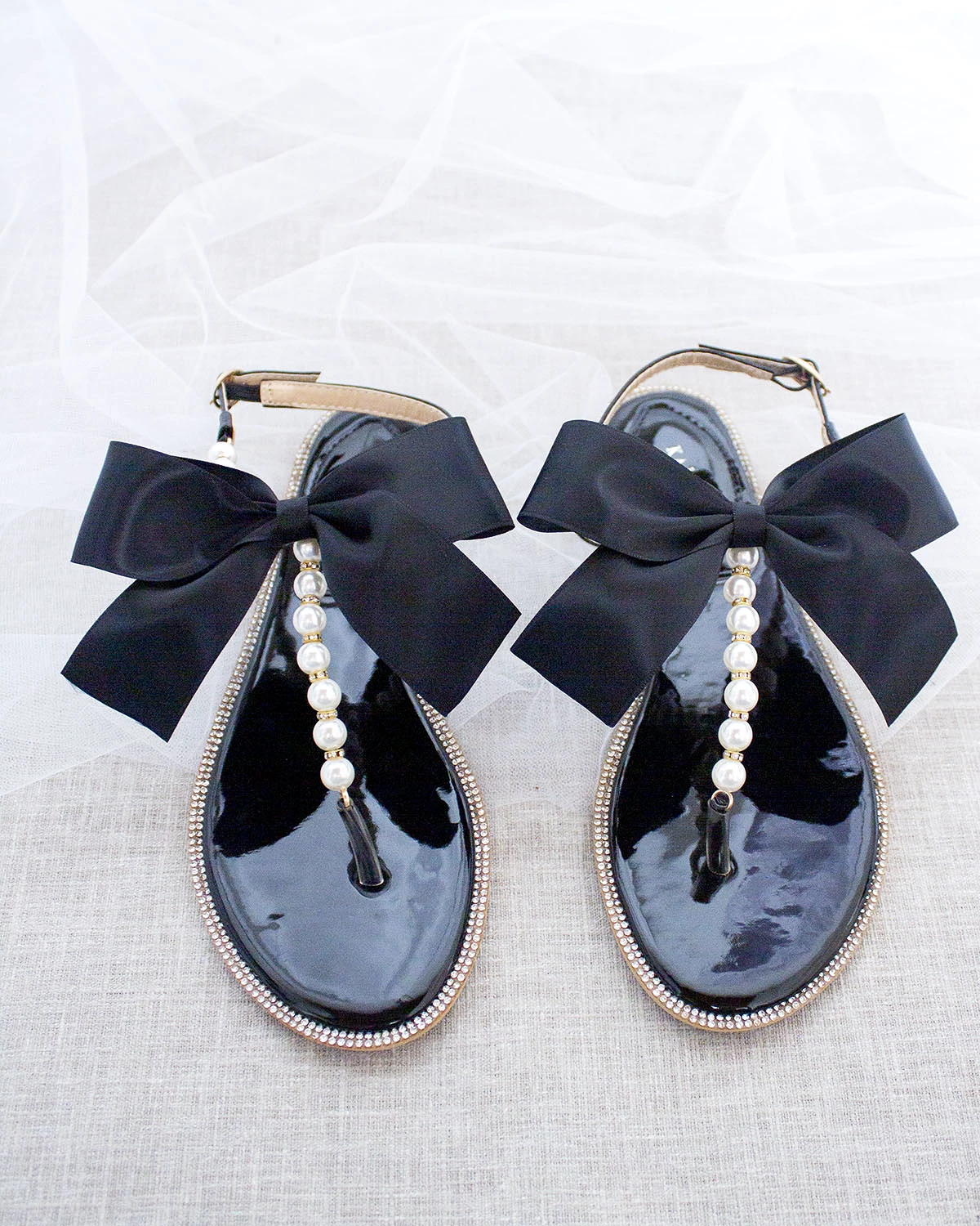 Black T-Strap Pearl Sandals with Rhinestone Embellishments and Large Satin Bow