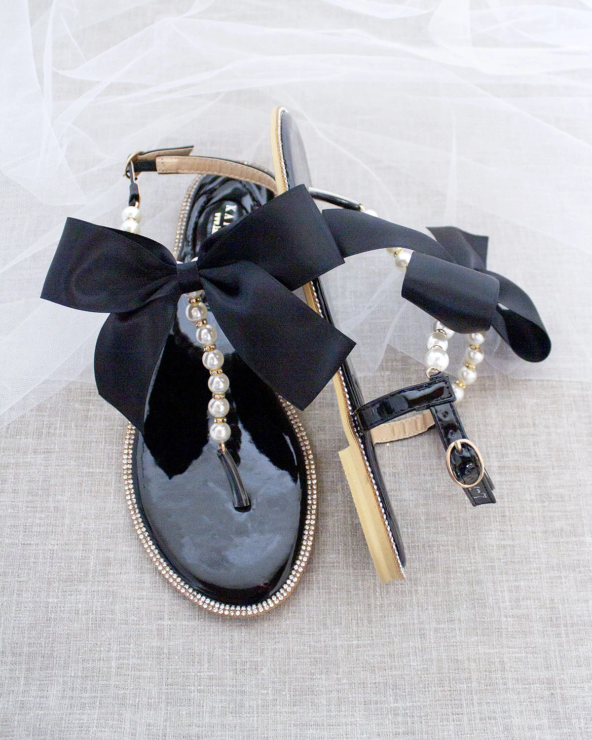 Black T-Strap Pearl Sandals with Rhinestone Embellishments and Large Satin Bow