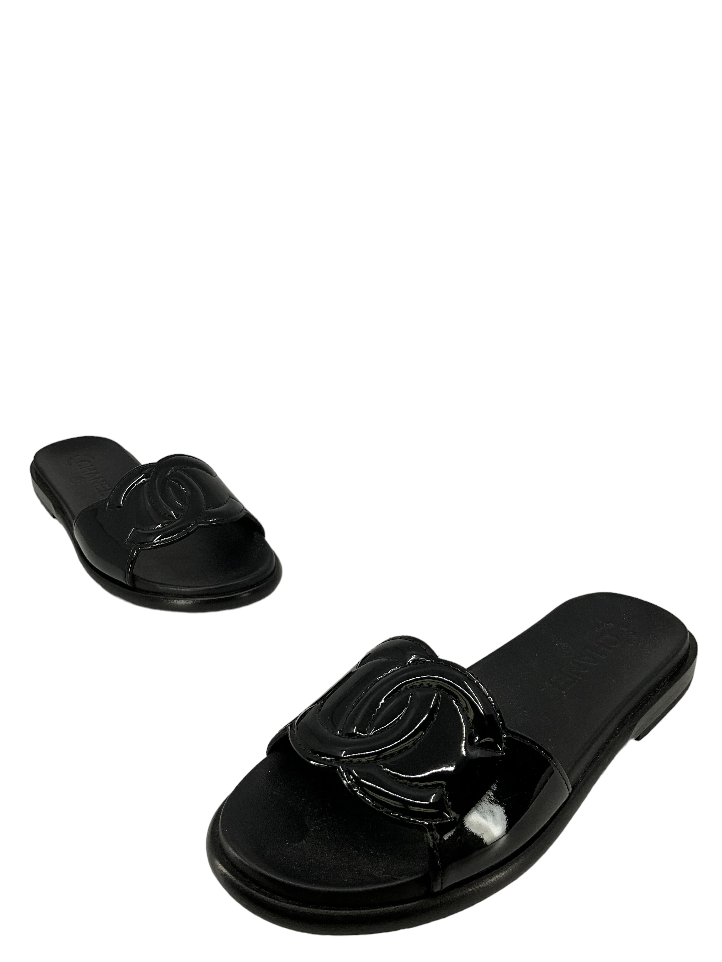 Chanel size 7 black leather sandals.