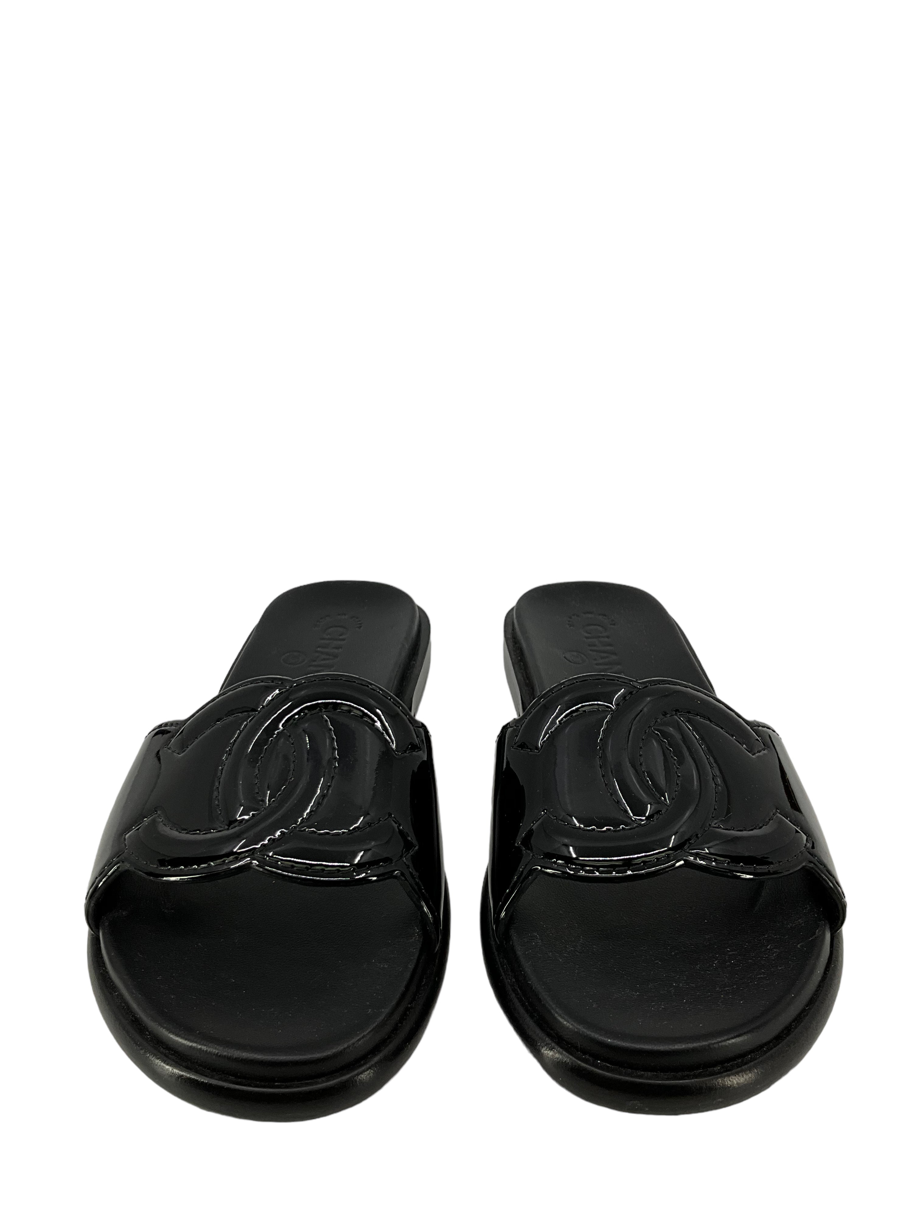 Chanel size 7 black leather sandals.