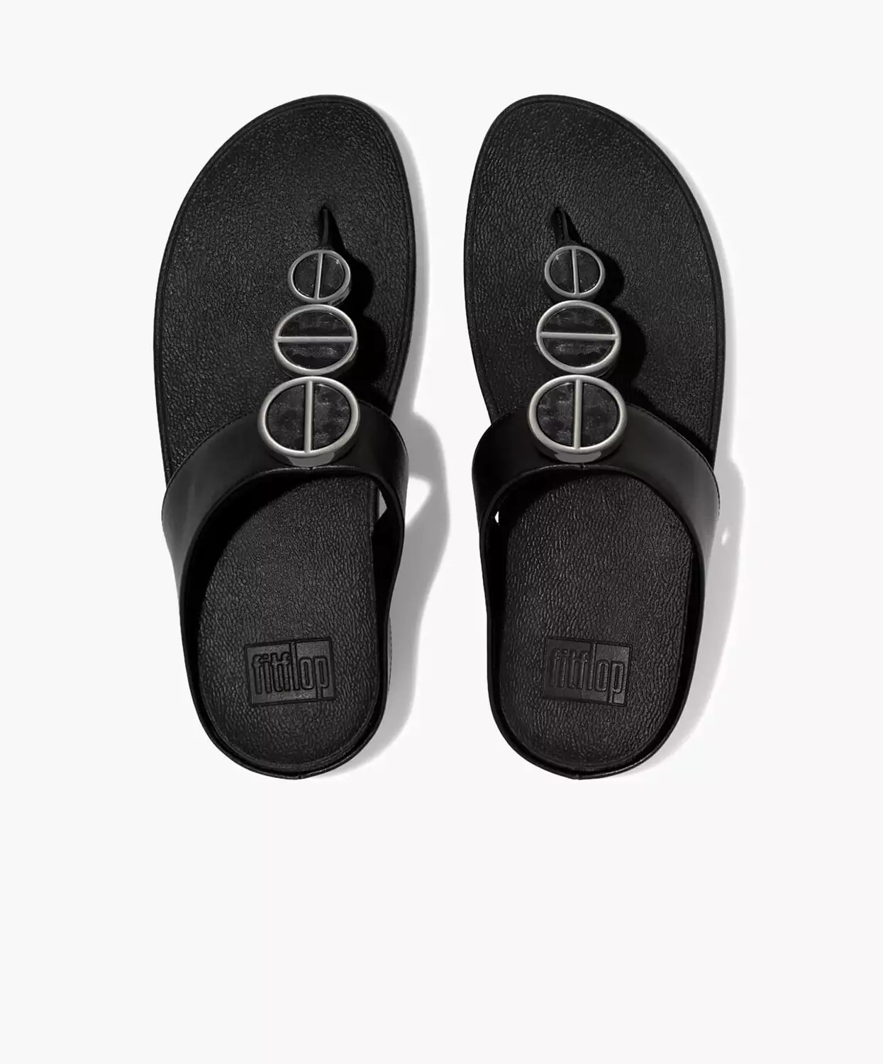 FitFlop black sandals with metallic trim and toe post