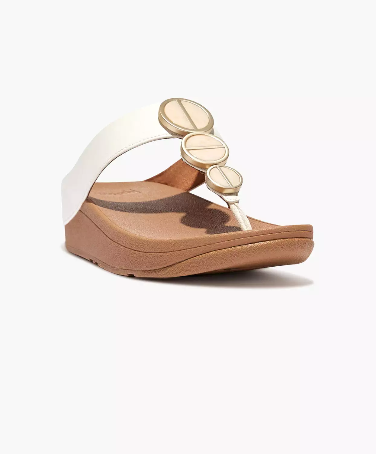 FitFlop sandals with metallic trim and toe post in cream color.