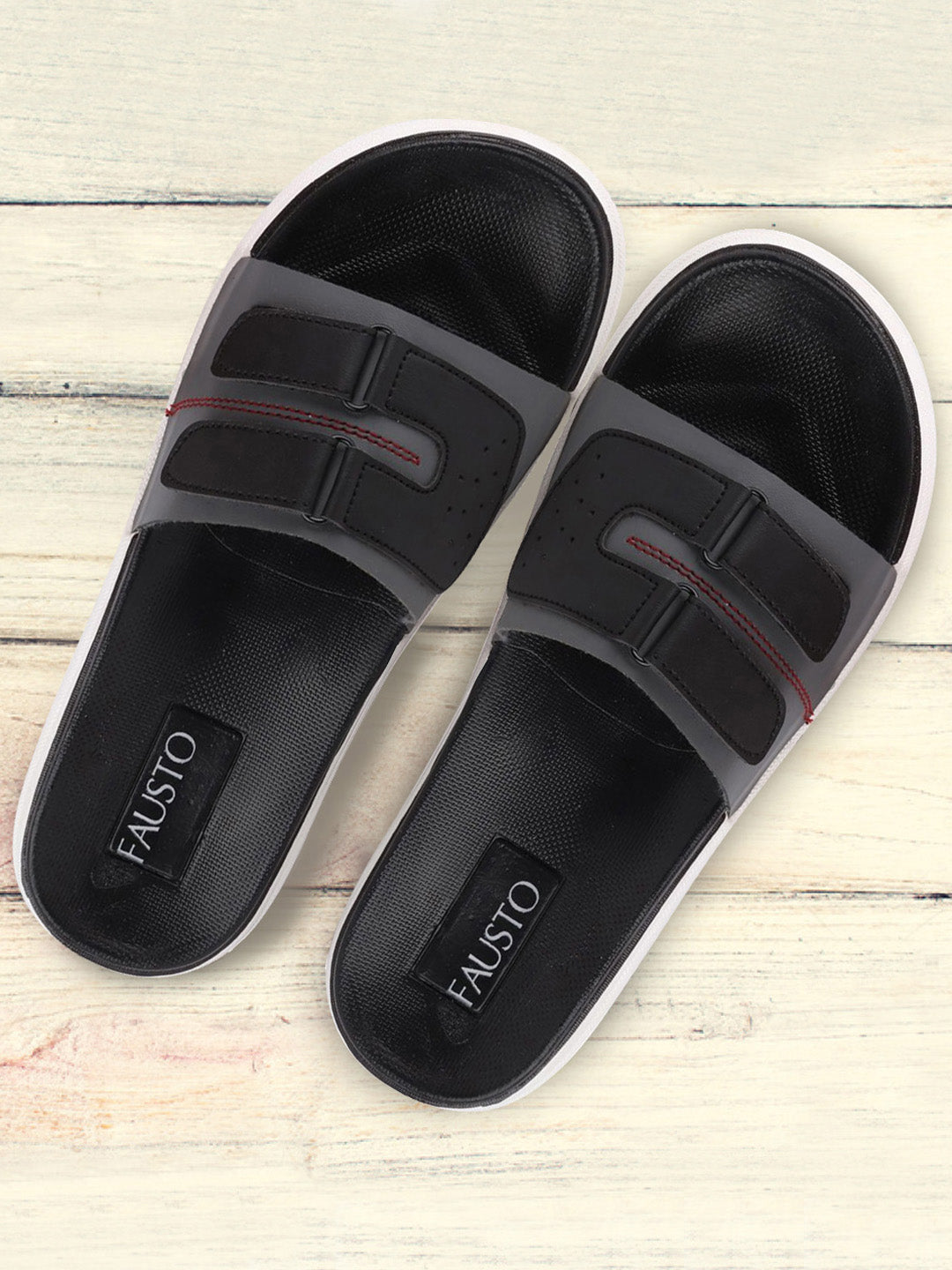 Grey and black slip-on flip-flops with multiple straps for men.