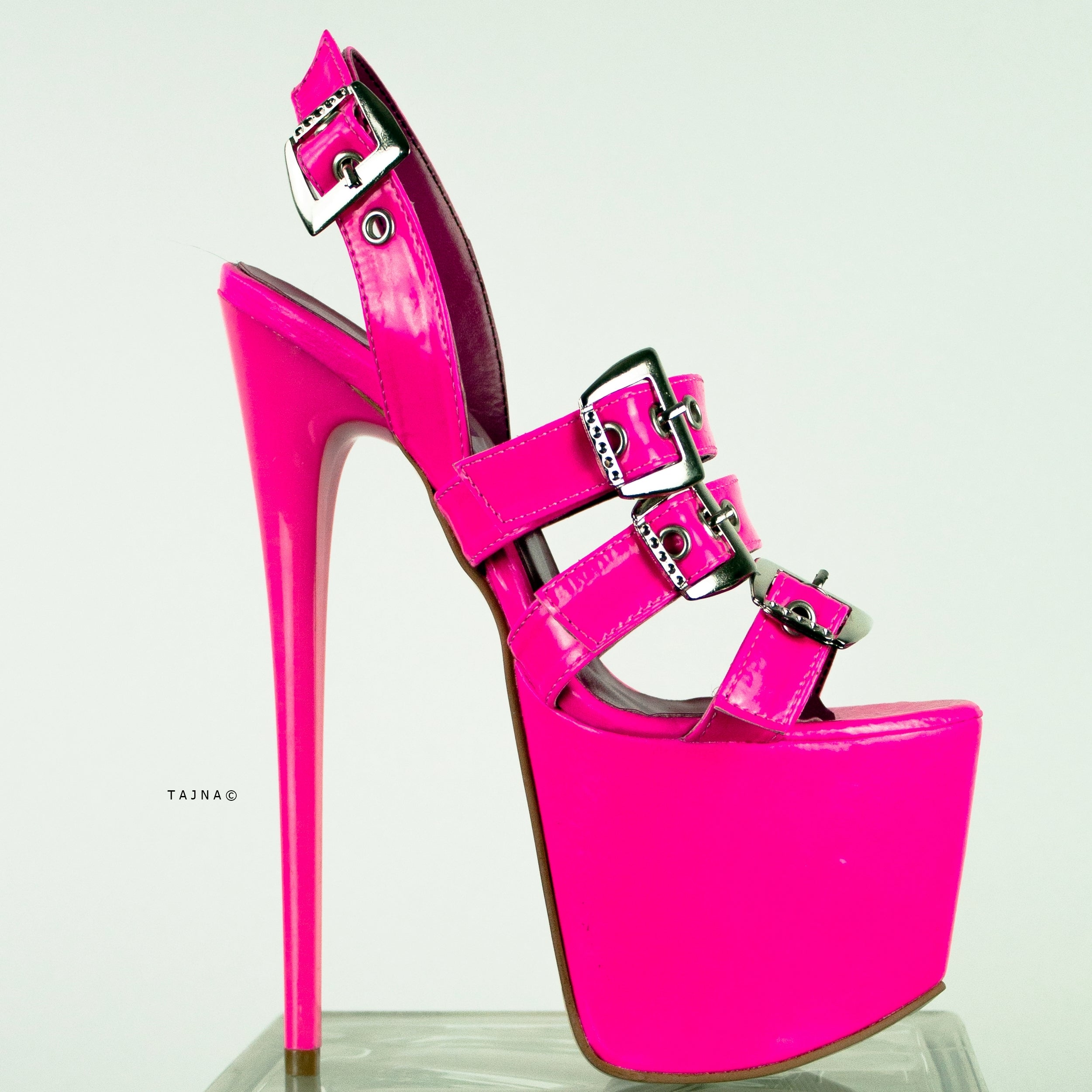 neon pink high heel sandals with multiple belts