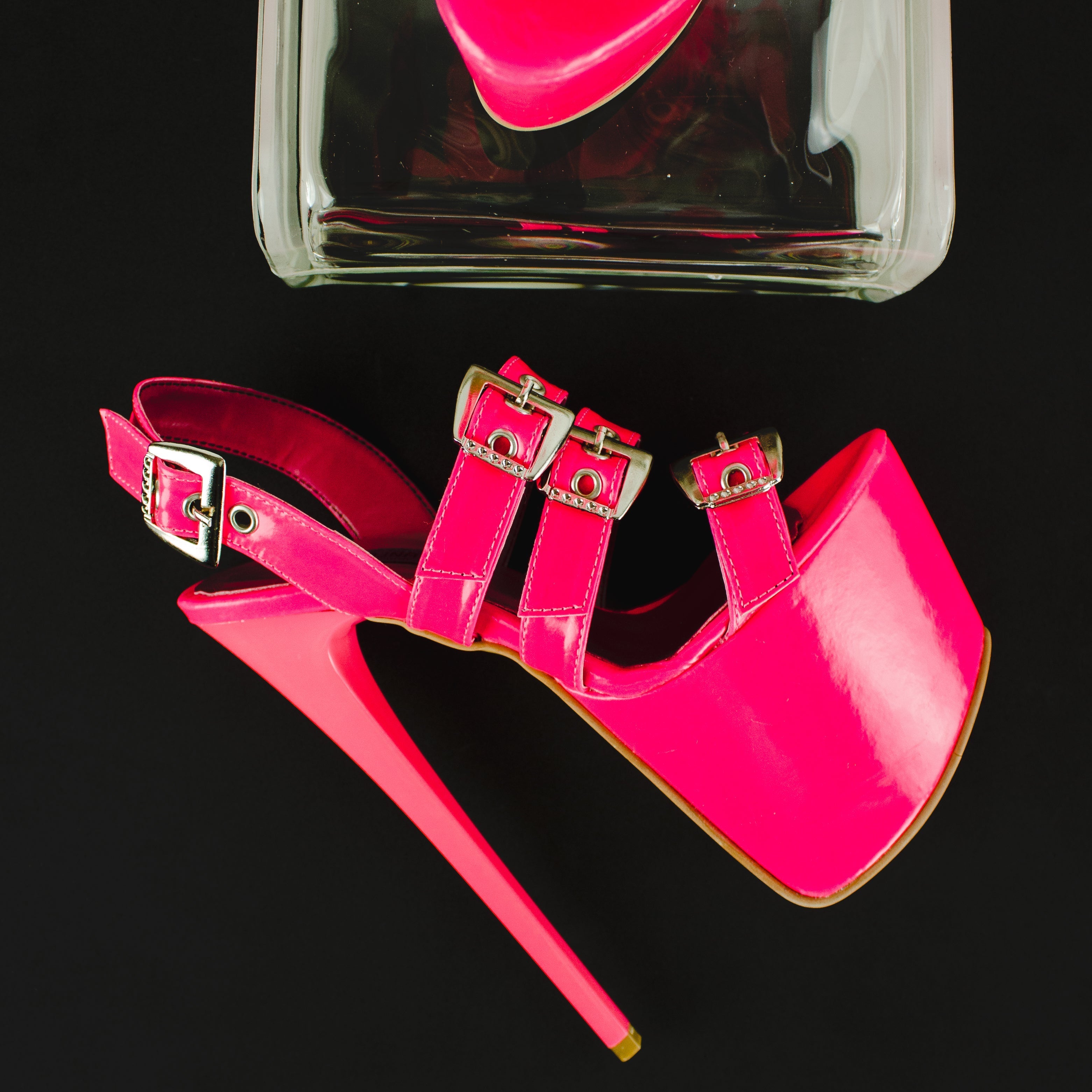 neon pink high heel sandals with multiple belts