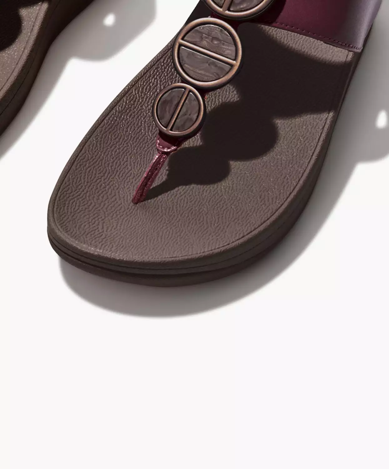 Plum FitFlop sandals with metallic trim toe post