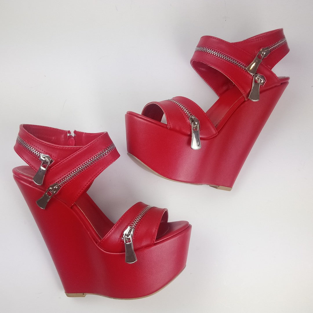 Red wedges sandals with zipper detail.