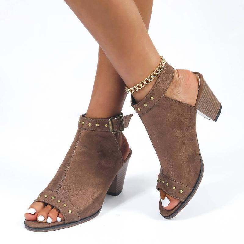 Rivet peep toe sandals with adjustable buckle and chunky heel.