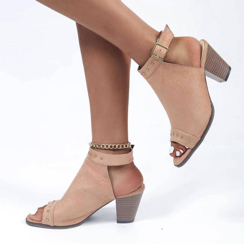 Rivet peep toe sandals with adjustable buckle and chunky heel.