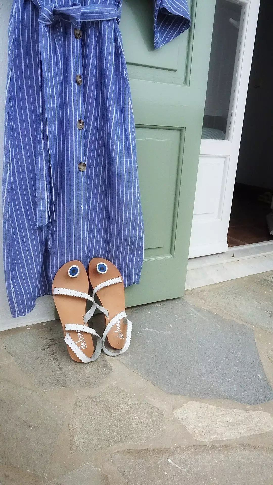 White flat leather sandals with evil-eye design