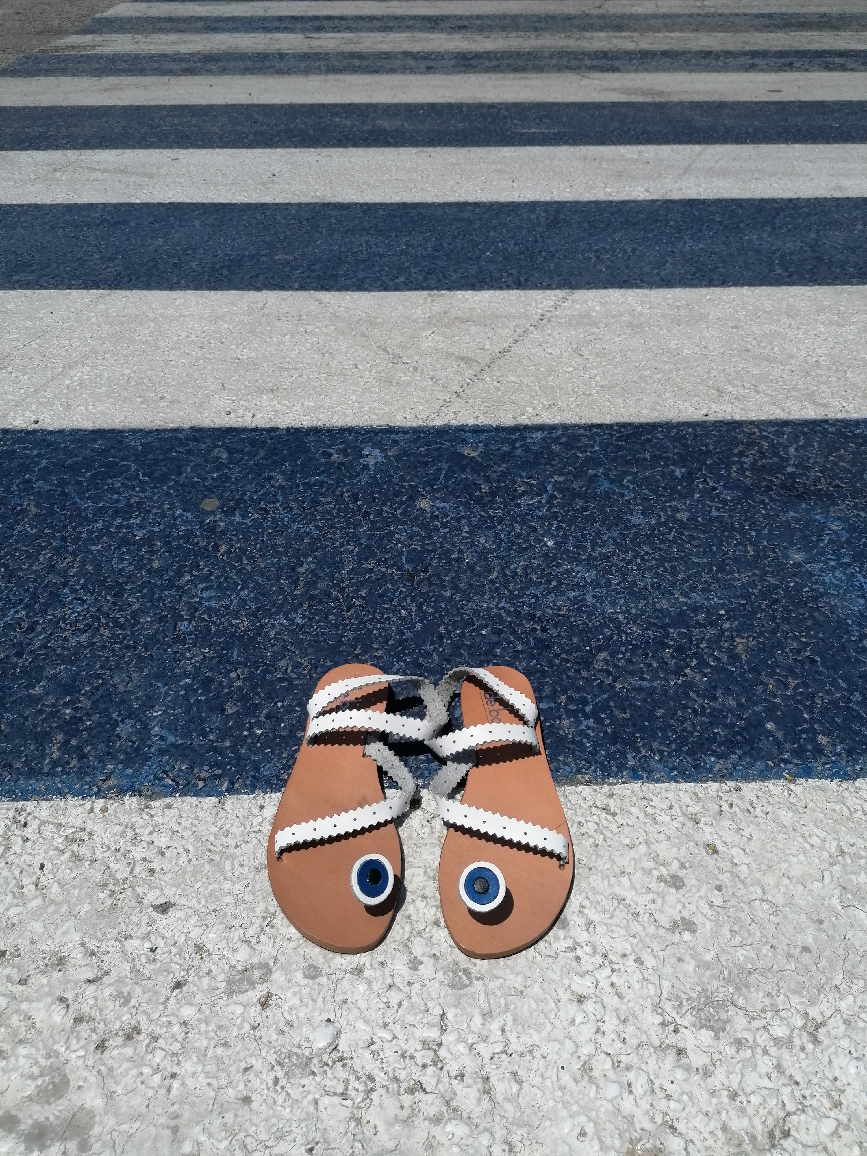 white leather sandals, evil eye design